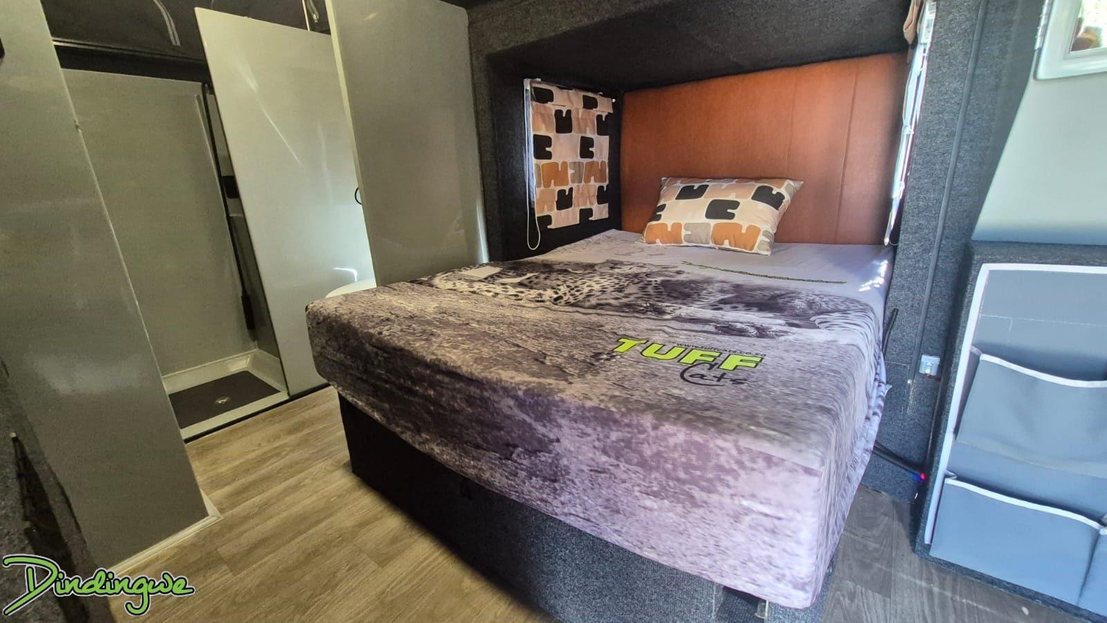 Dindingwe interior with island bed